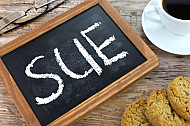 sue
